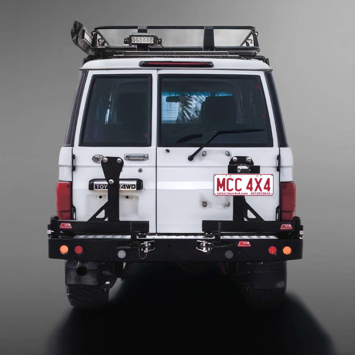 MCC Rear Replacement Bumper with left and right spare wheel carriers and towbar for Toyota LandCruiser 79 Series pickup